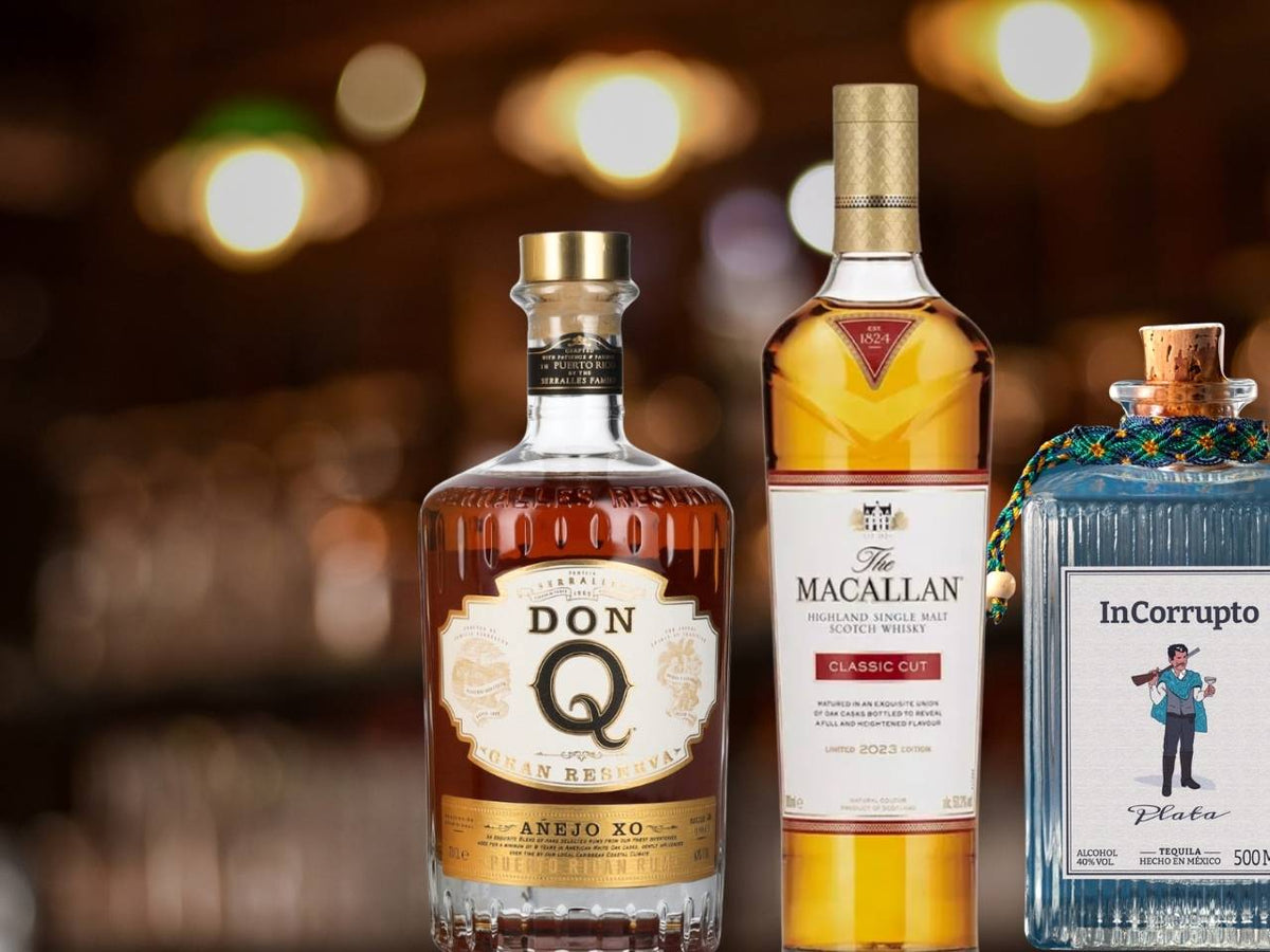 Auswahl edler Spirituosen: Drei Flaschen Tequila, Rum und Whisky für den passenden Zigarren-Genuss.